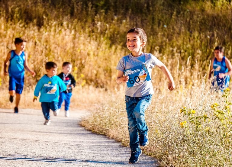 Boys running in a park