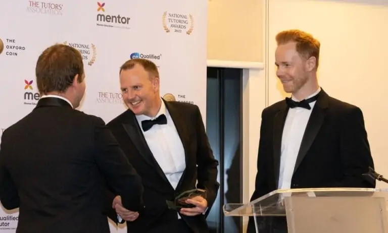 Bright Heart's co-founders collecting Tuition Business of the Year award